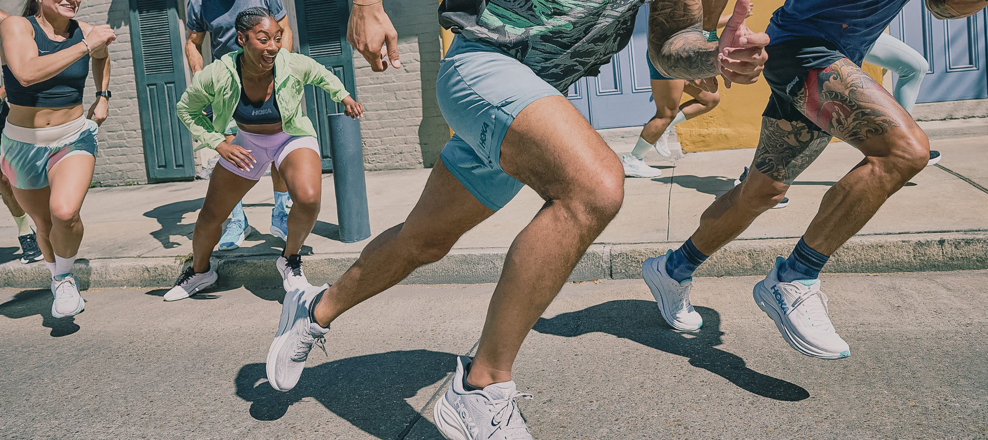 A group of people running on a street