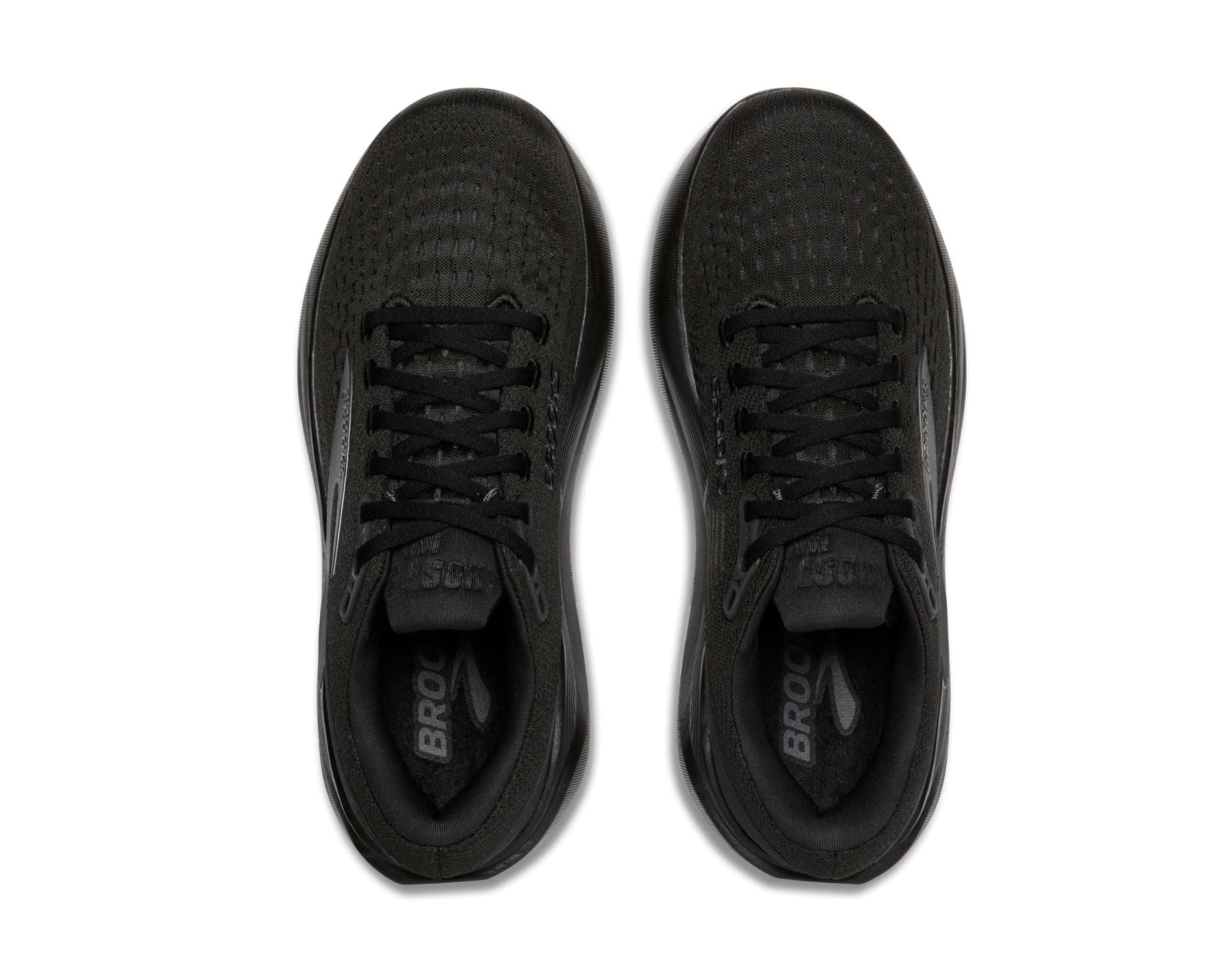 Black athletic shoes with textured sole on a white background