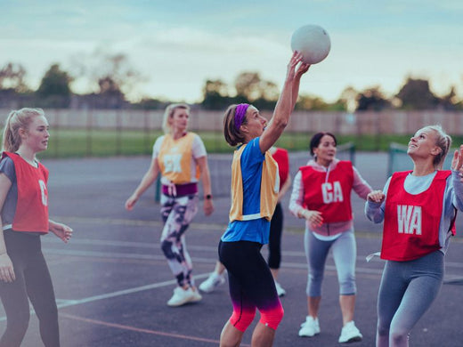 A group of women playing netball