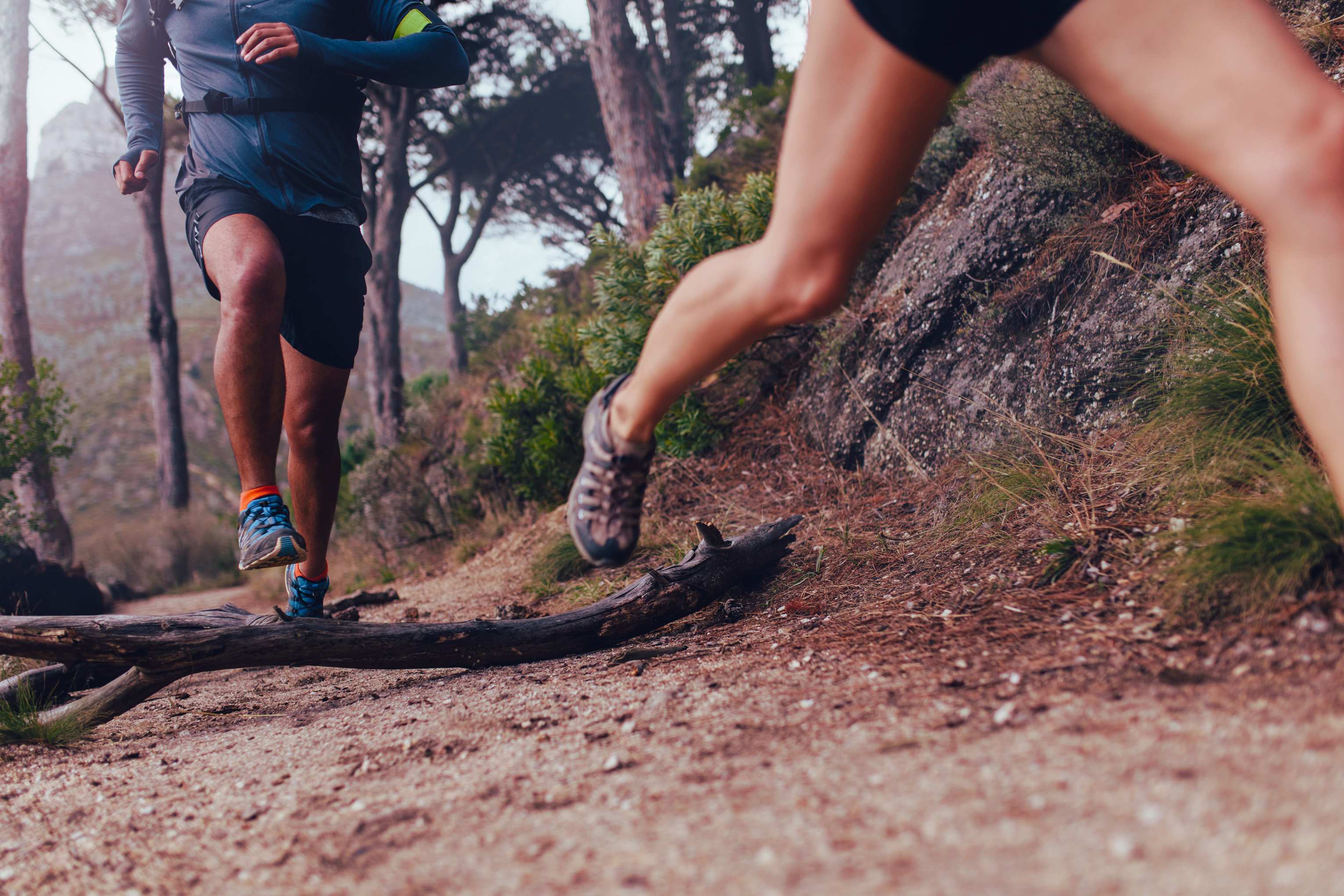 A Couple running on a trail