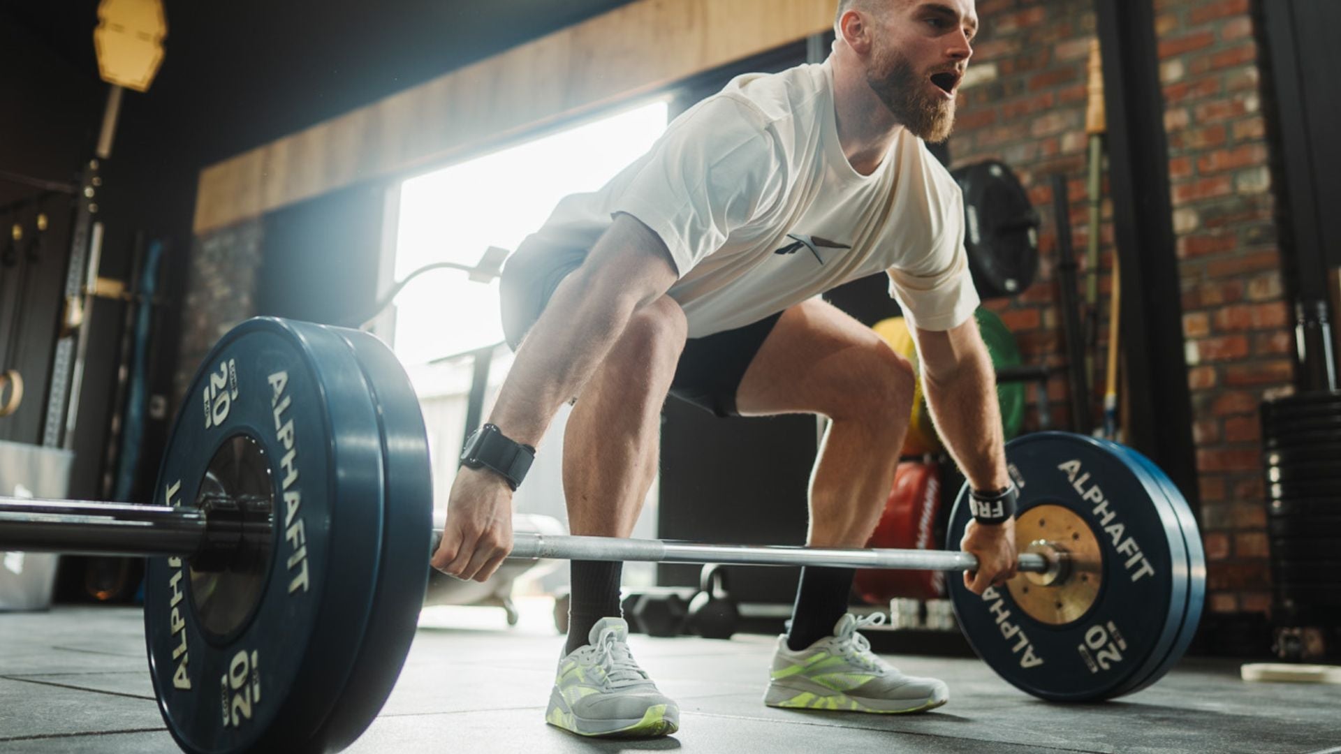 A man is lifting a barbell