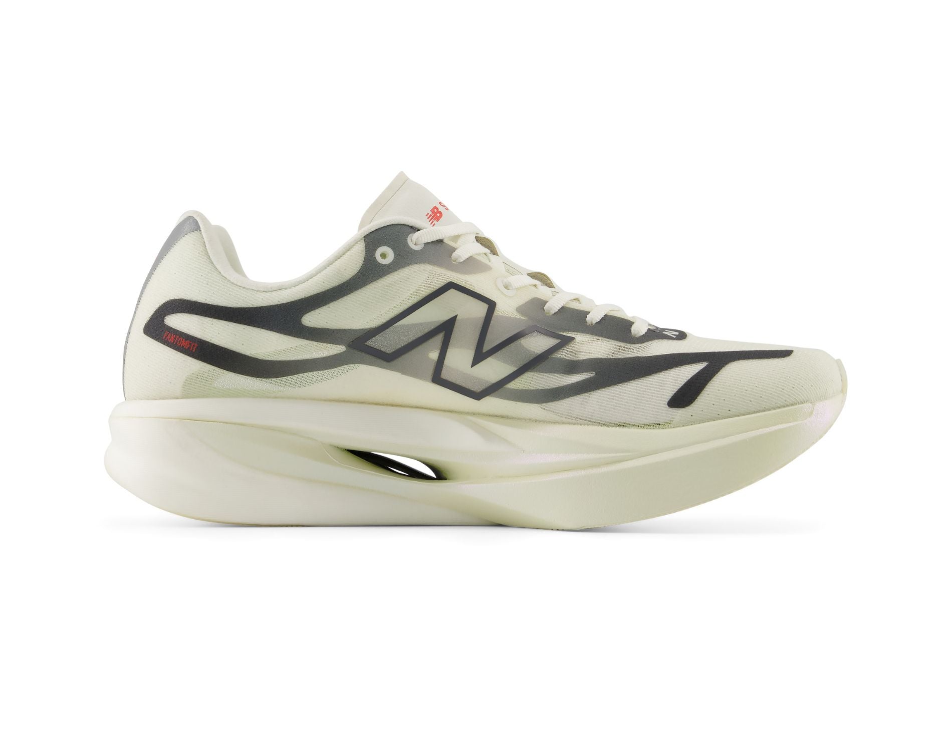 A New Balance running shoe in off-white and dark gray, shown from a side profile view against a solid white background.