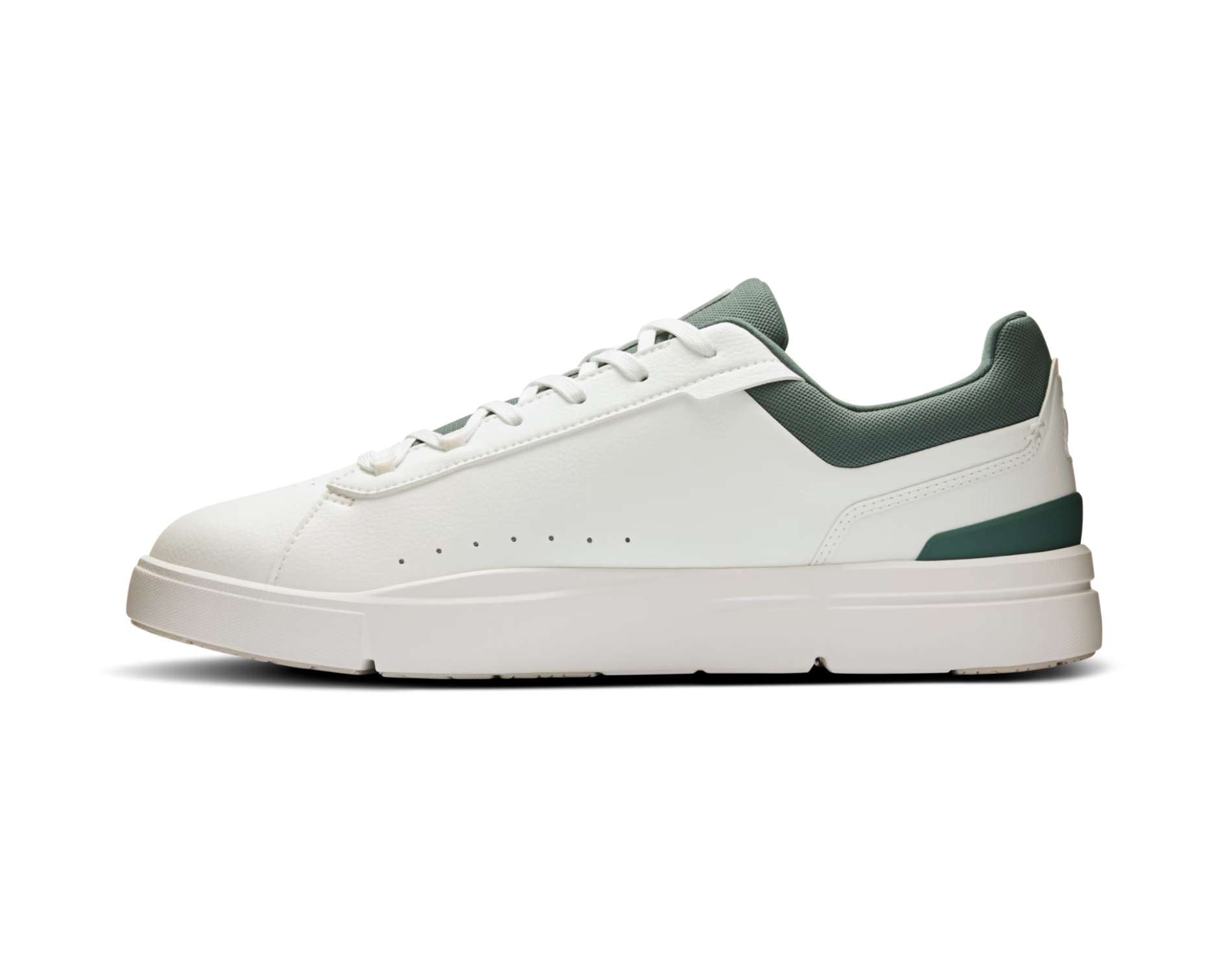 White sneaker with green accents on a white background