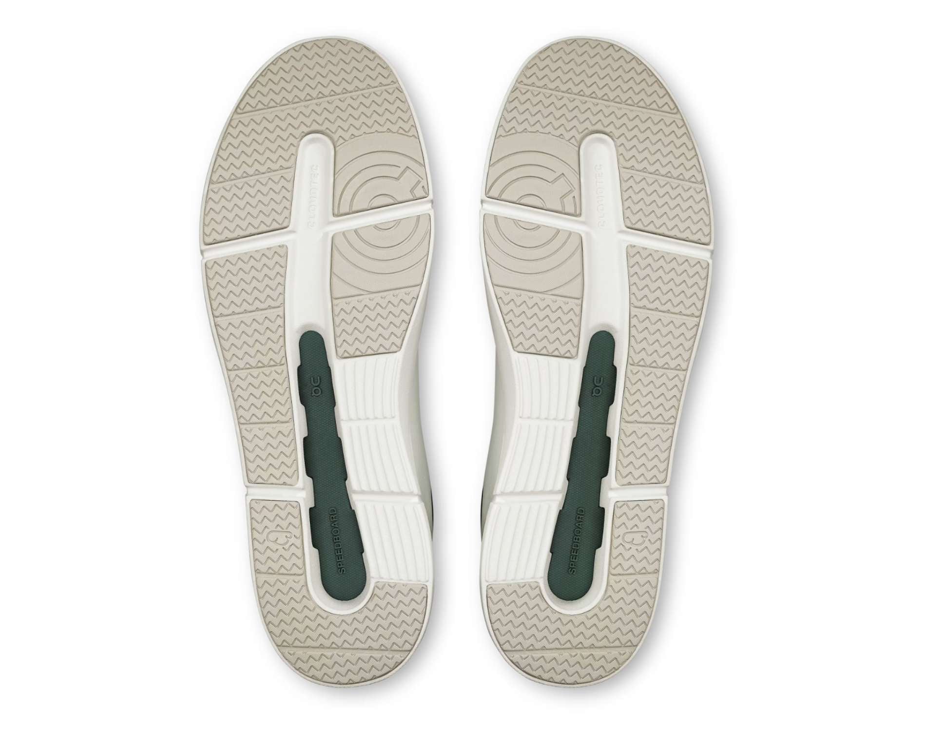 Top view of a pair of sandals with a white sole and green straps on a white background