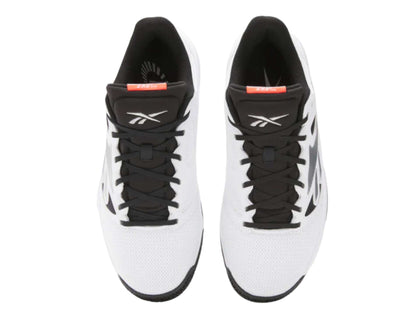 Pair of white and black athletic shoes with visible Reebok logo on a white background