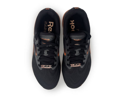 Black Reebok running shoes with copper accents on a white background